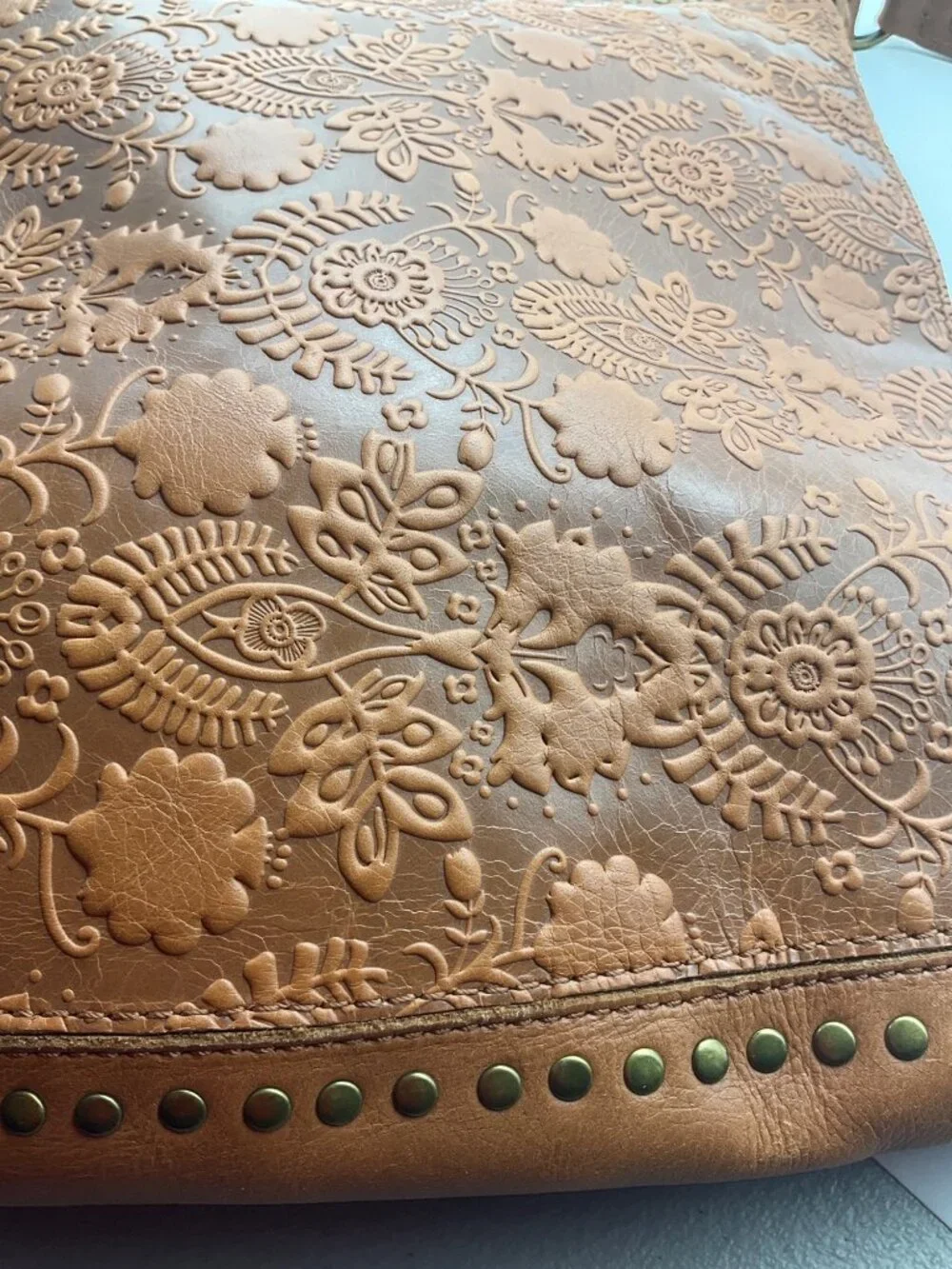 The Sak Leather Hobo Indio Floral Tooled Slouchy Tan Shoulder Bag Tassel Charm